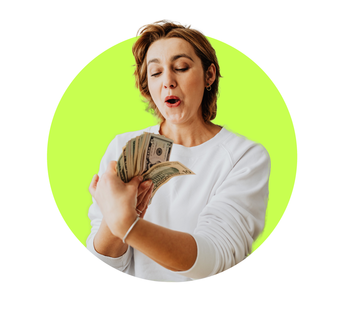 Happy woman holding money